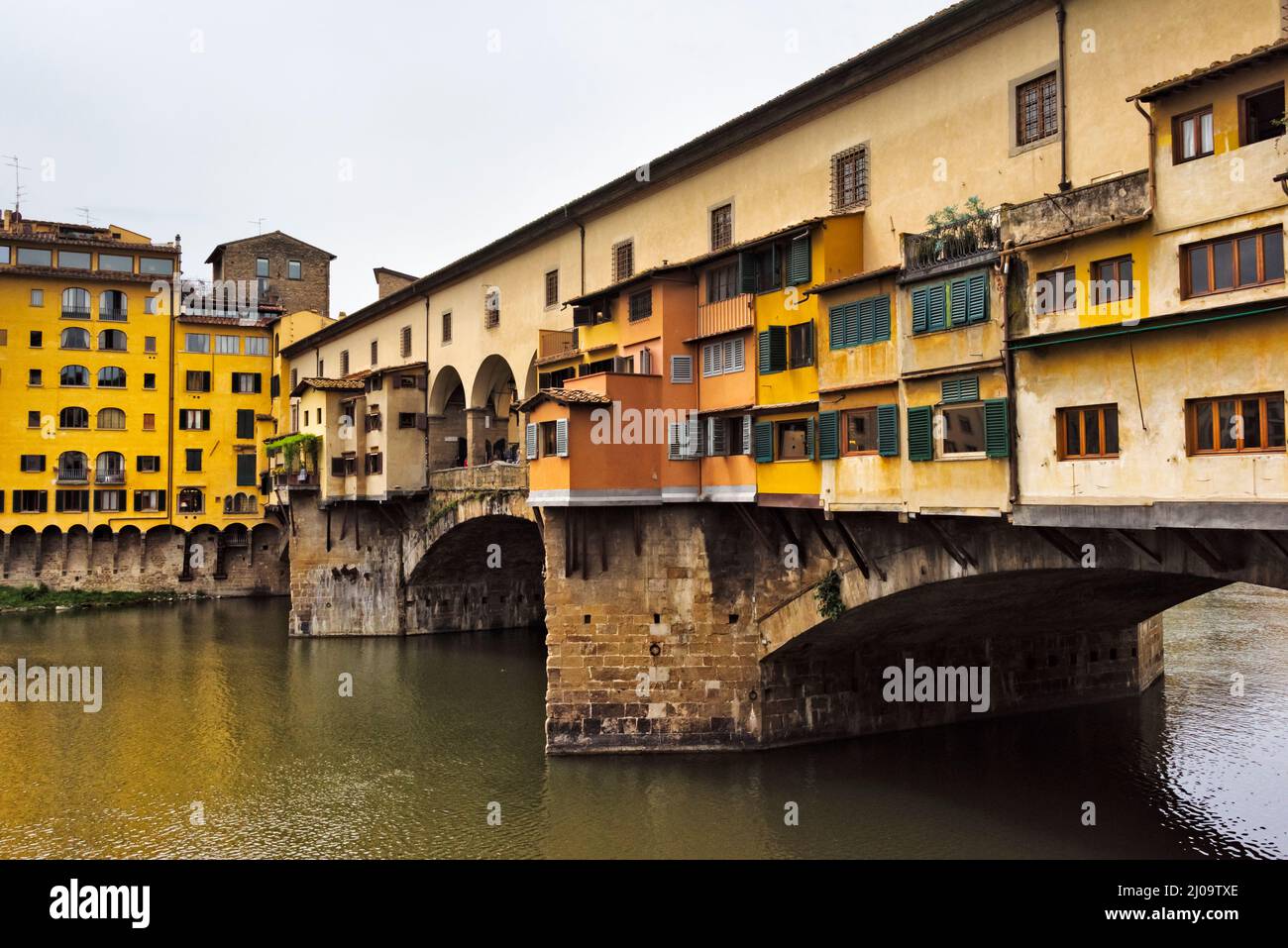 Ponte Vecchio, a medieval bridge over the Arno River, Florence, Tuscany Region, Italy Stock Photo