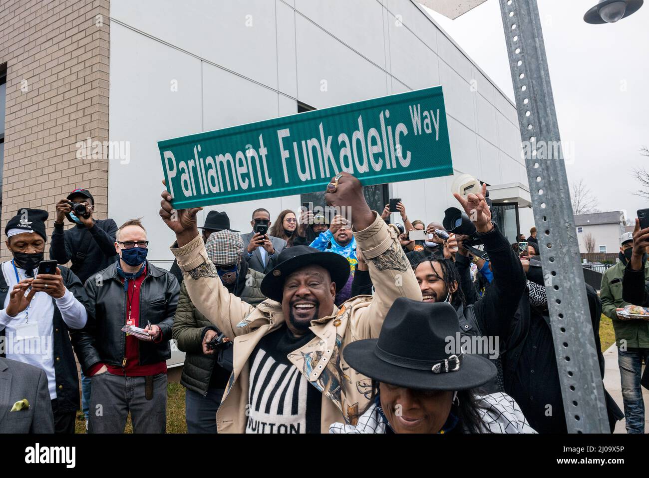 Plainfield, New Jersey, USA. 17th Mar, 2022. Musician GEORGE CLINTON holds the Parliament Funkadelic Way Street sign at South Second Youth Center in Plainfield, NJ. Clinton, founder of the Parliament and the Parliament-Funcadelic was honored by the city of Plainfield. The youth center now stands on the site of Clinton's former barber shop 'Silk Road.'' Stood. Clinton produced the funk hit was 'The Mothership Connection. Credit: ZUMA Press, Inc./Alamy Live News Stock Photo