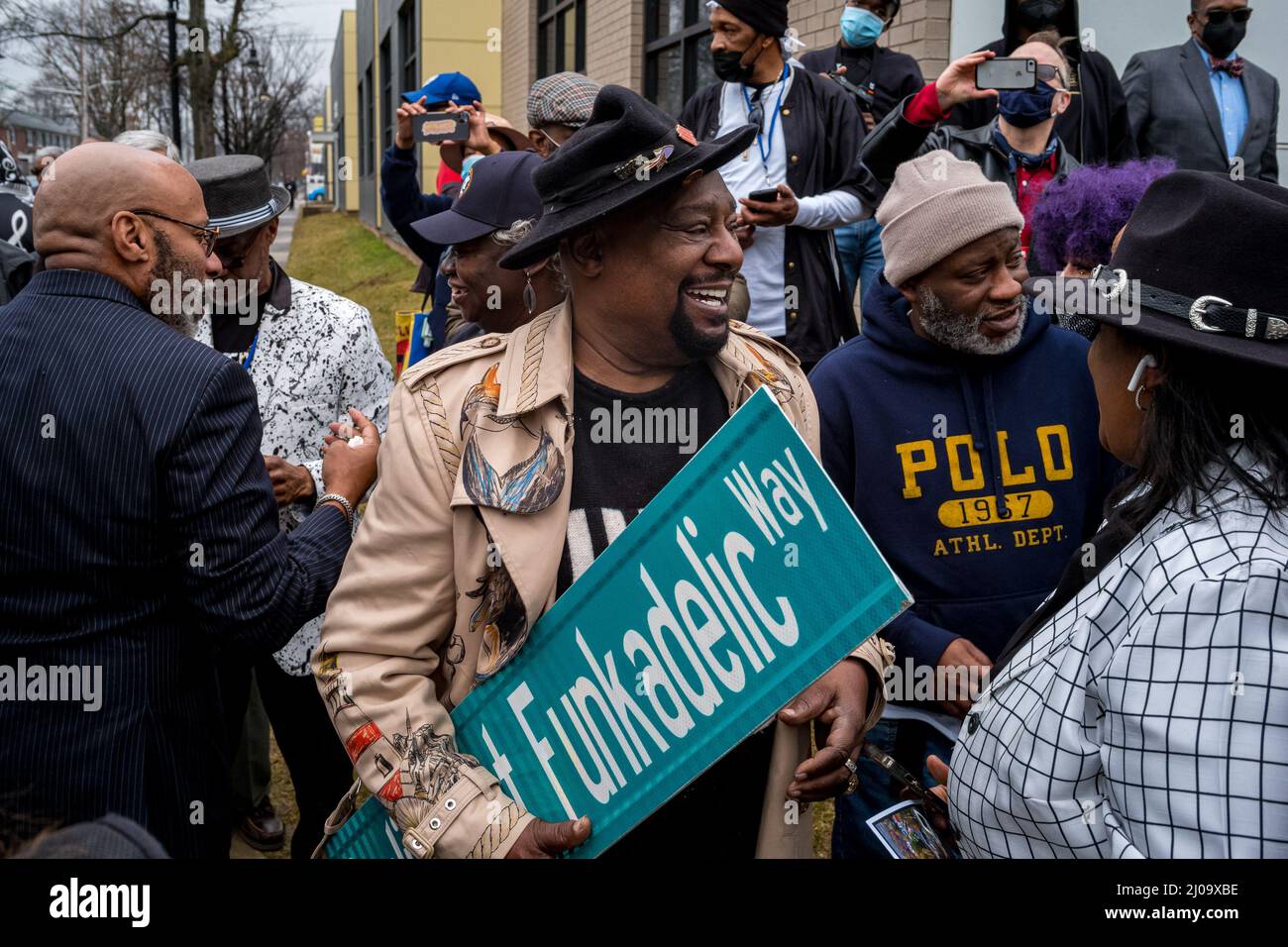 Plainfield, New Jersey, USA. 17th Mar, 2022. Musician GEORGE CLINTON holds the Parliament Funkadelic Way Street sign at South Second Youth Center in Plainfield, NJ. Clinton, founder of the Parliament and the Parliament-Funcadelic was honored by the city of Plainfield. The youth center now stands on the site of Clinton's former barber shop 'Silk Road.'' Stood. Clinton produced the funk hit was 'The Mothership Connection. Credit: ZUMA Press, Inc./Alamy Live News Stock Photo