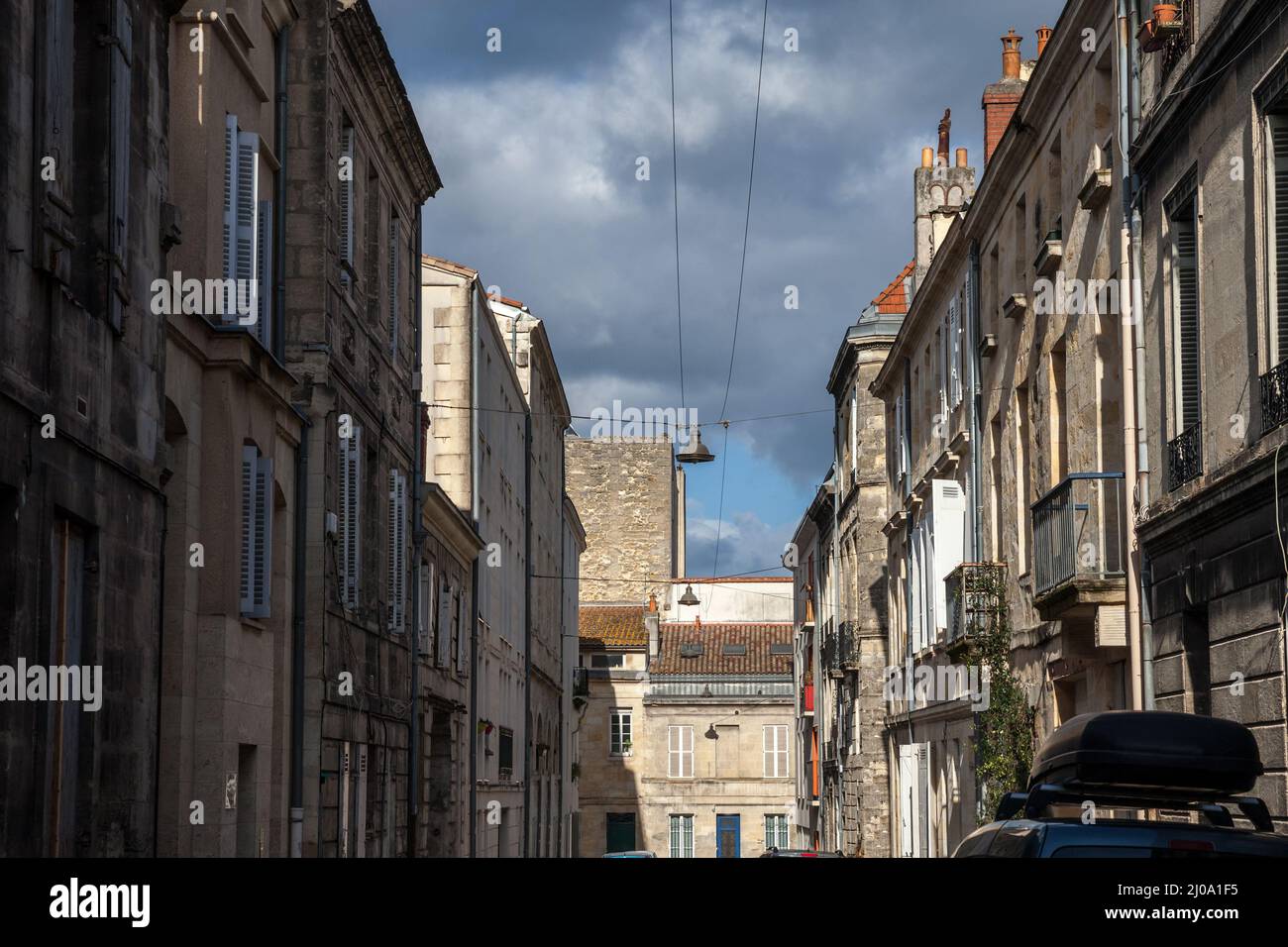 Selective blur on typical bordeaux buildings called echoppes bordelaises in a typical french city street in the historical center of Bordeaux, France, Stock Photo