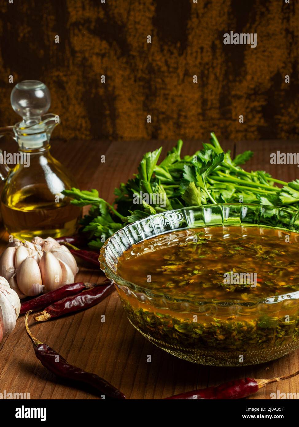 Traditional Argentine chimichurri sauce, olive oil, garlic, parsley and chili Stock Photo Alamy