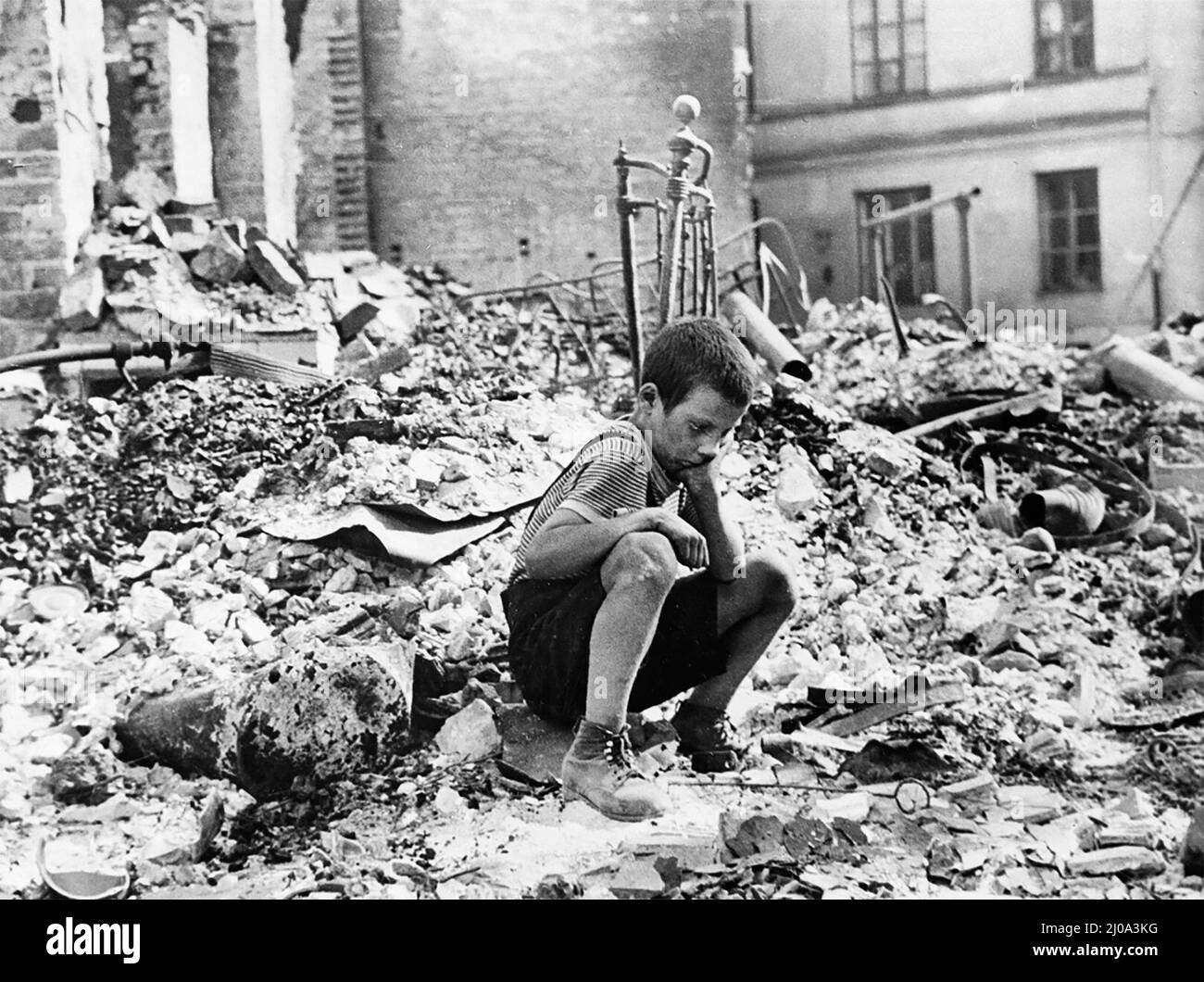 Polish kid in the ruins of Warsaw September 1939 Stock Photo