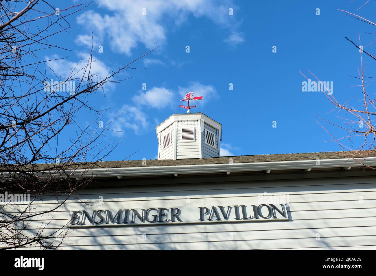 Washington State University’s Ensminger Pavilion, a former livestock-judging barn built in 1933 turned a modern events center, with WSU weathervane. Stock Photo