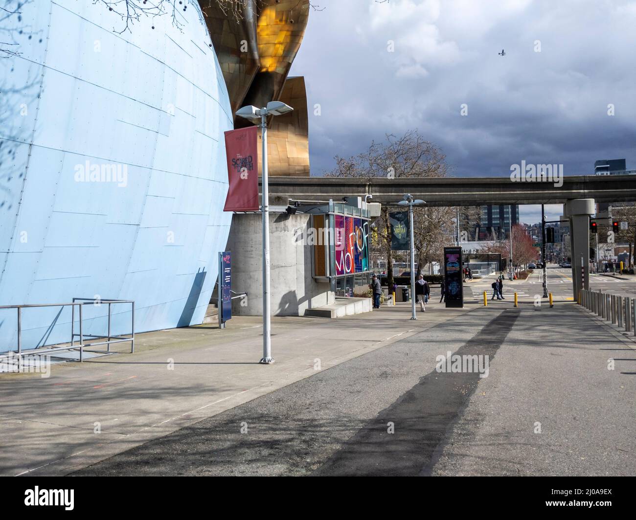 Seattle, WA USA - circa March 2022: Side street view of pedestrian traffic near the Museum of Pop Culture on an overcast day. Stock Photo