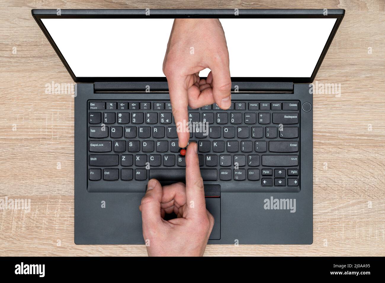 Touching fingers above computer keyboard. Two hands of touching with the index fingers. Business topics - connections. Business metaphor. Stock Photo