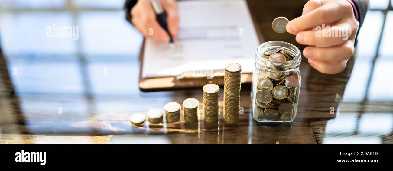 Pension Fund Jar. Coins And Inflation. Money Deposit Stock Photo