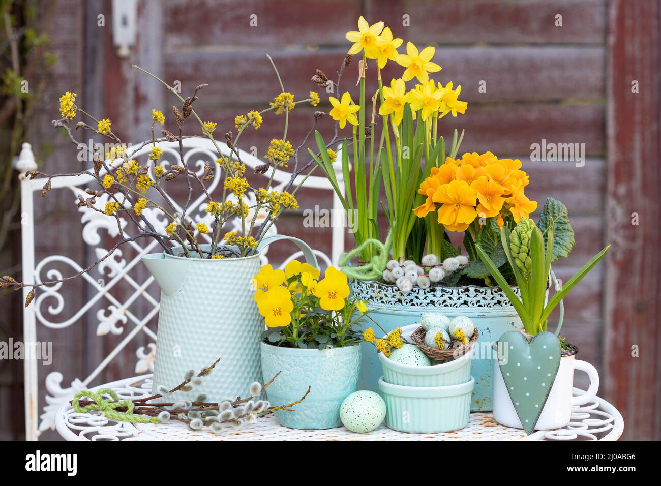 easter decoration with yellow spring flowers and easter eggs Stock Photo