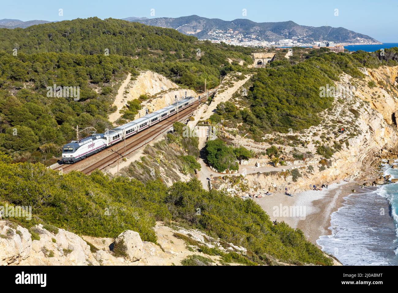 Sitges, Spain - February 20, 2022: Talgo train operated by RENFE near Sitges in Spain. Stock Photo
