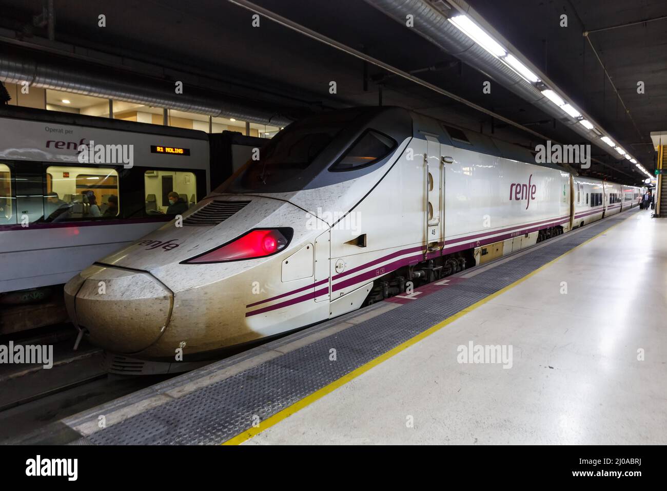 Barcelona, Spain - February 18, 2022: AVE Talgo 250 high-speed train operated by RENFE rail at Barcelona Sants railway station in Barcelona, Spain. Stock Photo