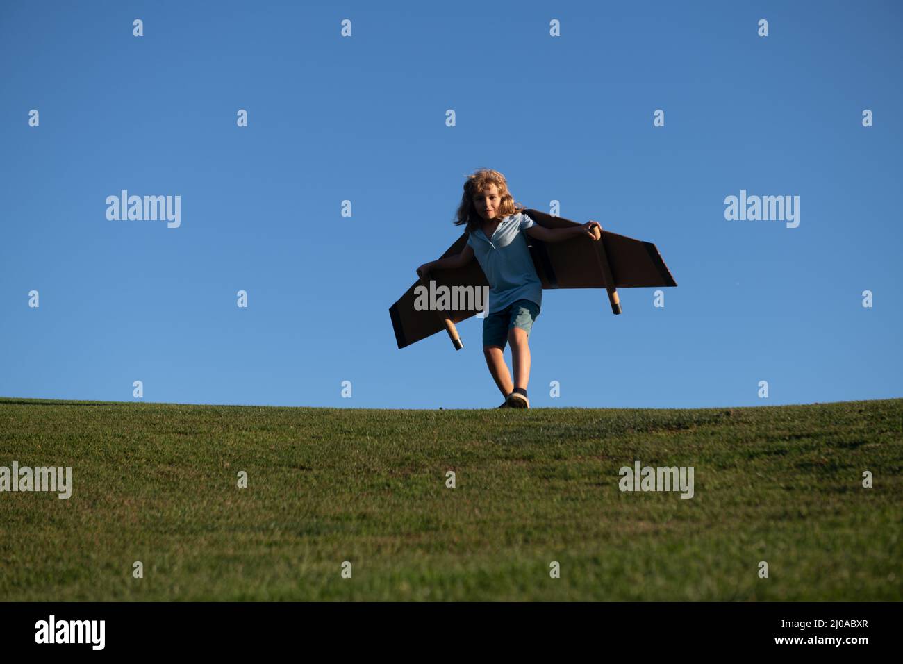 Child boy dreams of a rocket pilot. Imagination and motivation