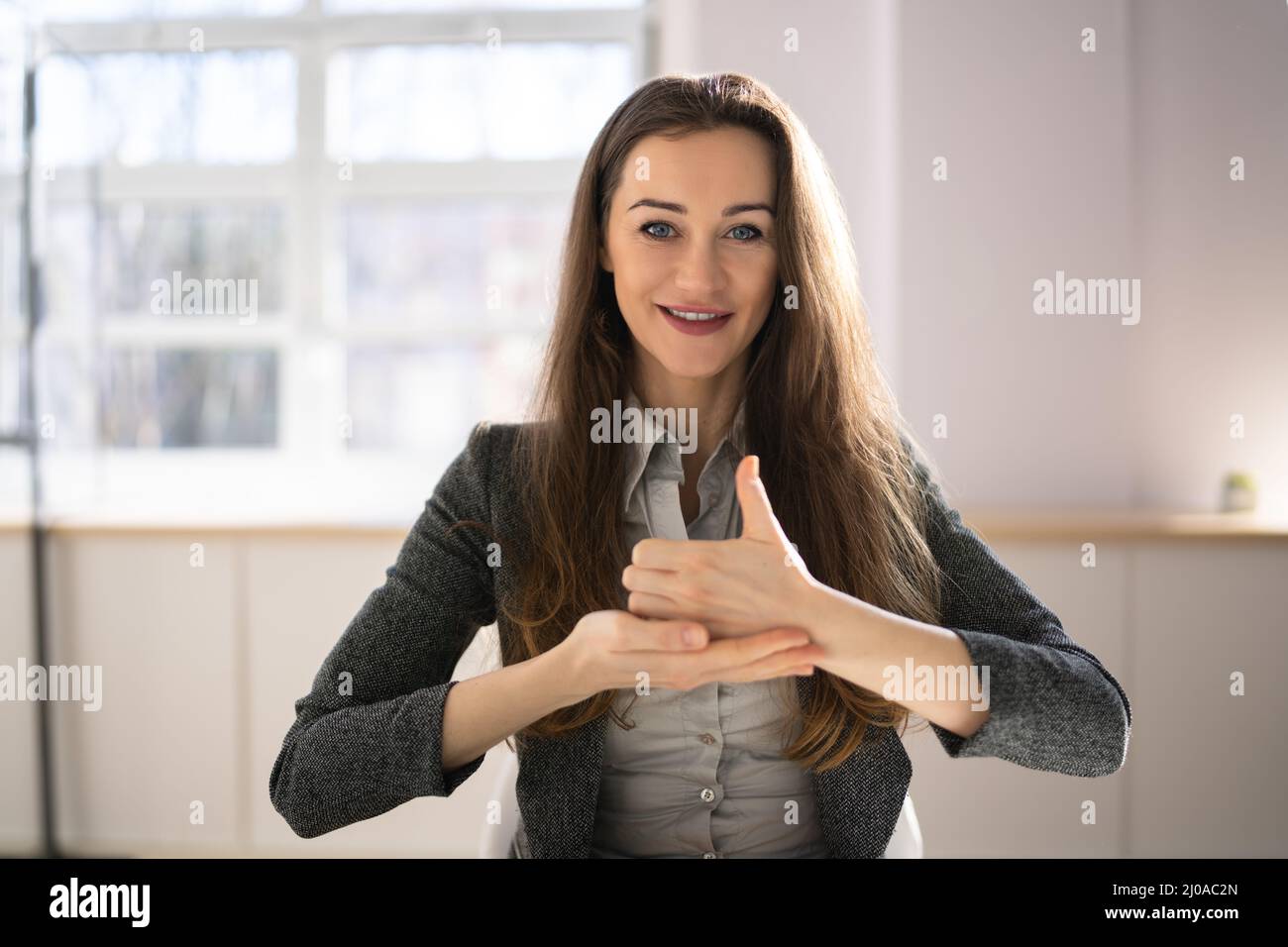 Learning Sign Language. Audiology And Deaf Disability Stock Photo