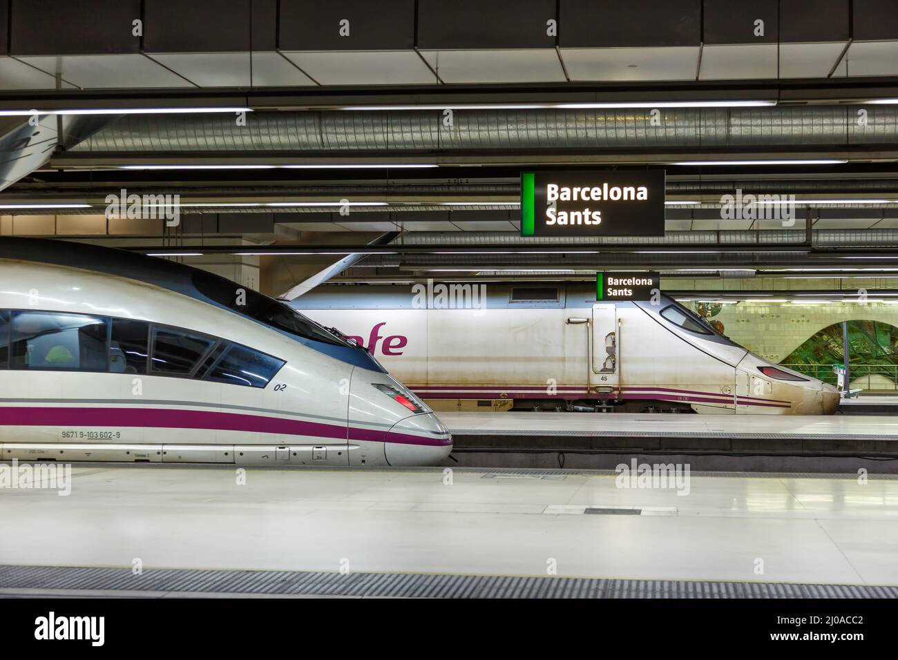 Barcelona, Spain - February 19, 2022: AVE high-speed trains operated by RENFE rail at Barcelona Sants railway station in Barcelona, Spain. Stock Photo