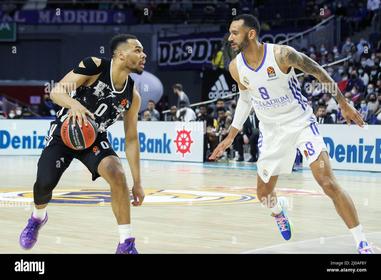 Madrid, Spain. 17th Mar, 2022. Elie Okobo of Asvel Lyon-Villeurbanne and Adam Hanga of Real Madrid during the Turkish Airlines Euroleague basketball match between Real Madrid and Asvel Lyon-Villeurbanne on march 17, 2022 at Wizink Center in Madrid, Spain Credit: Independent Photo Agency/Alamy Live Newss Stock Photo