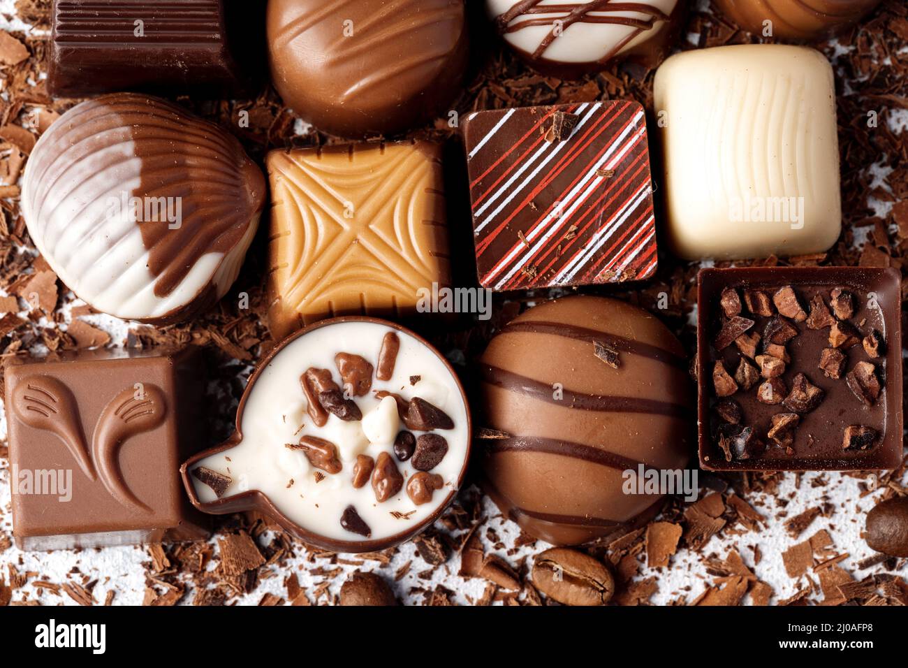 Chocolate candies and chocolate pieces pile for background Stock Photo