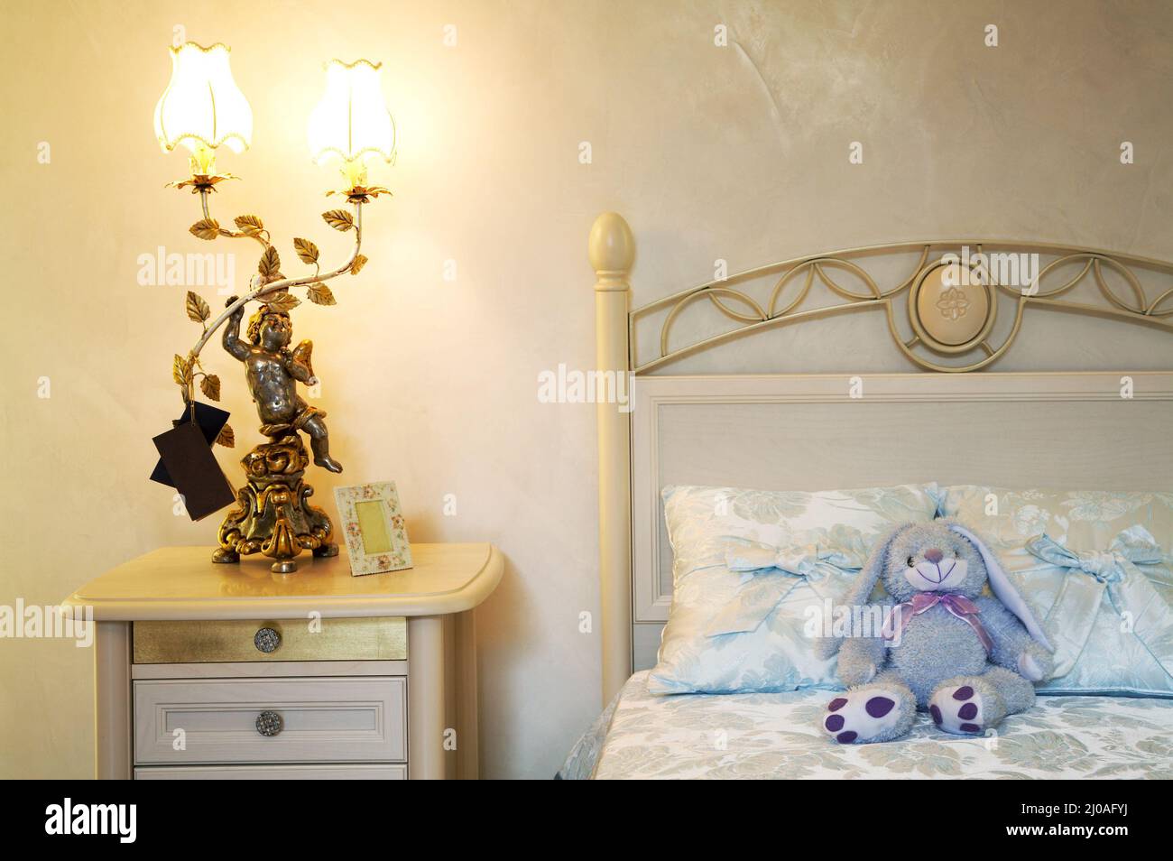 Toy hare on a bed Stock Photo