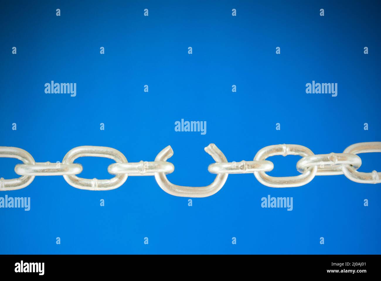 Steel chain with a broken link Stock Photo Alamy
