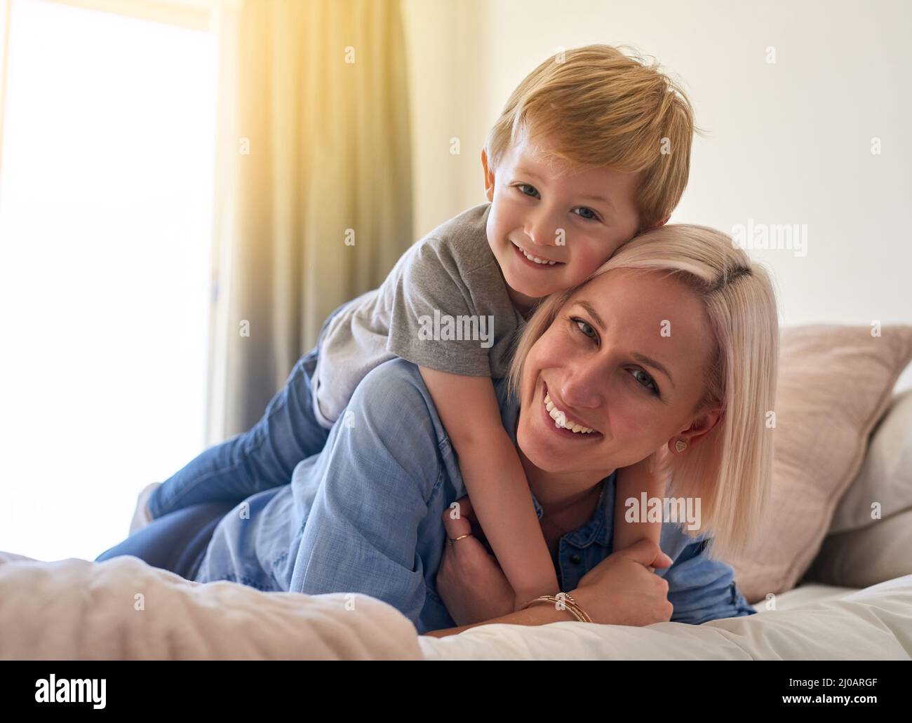 My world shines so much brighter because of him. Portrait of a mother and son spending some quality time together at home. Stock Photo