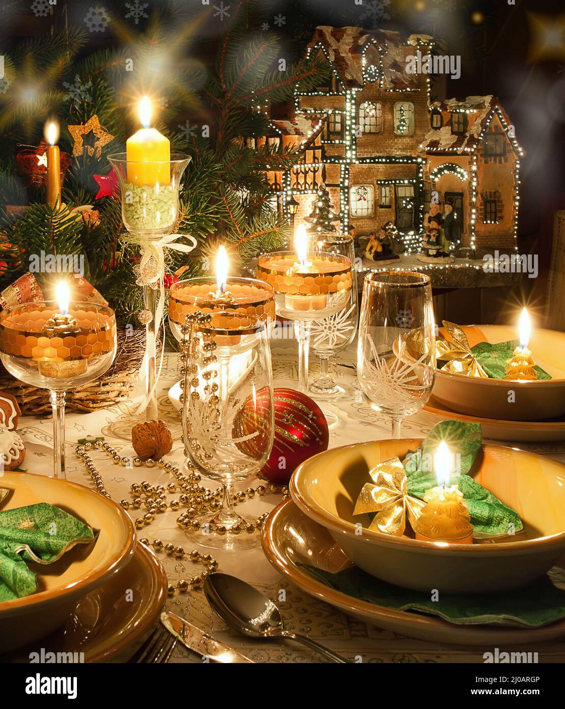 Christmas dinner table with candles with christmas atmosphere Stock Photo