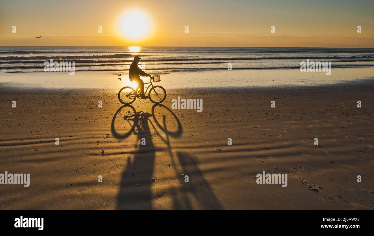 Bicycle ride at sunrise on cocoa beach Stock Photo