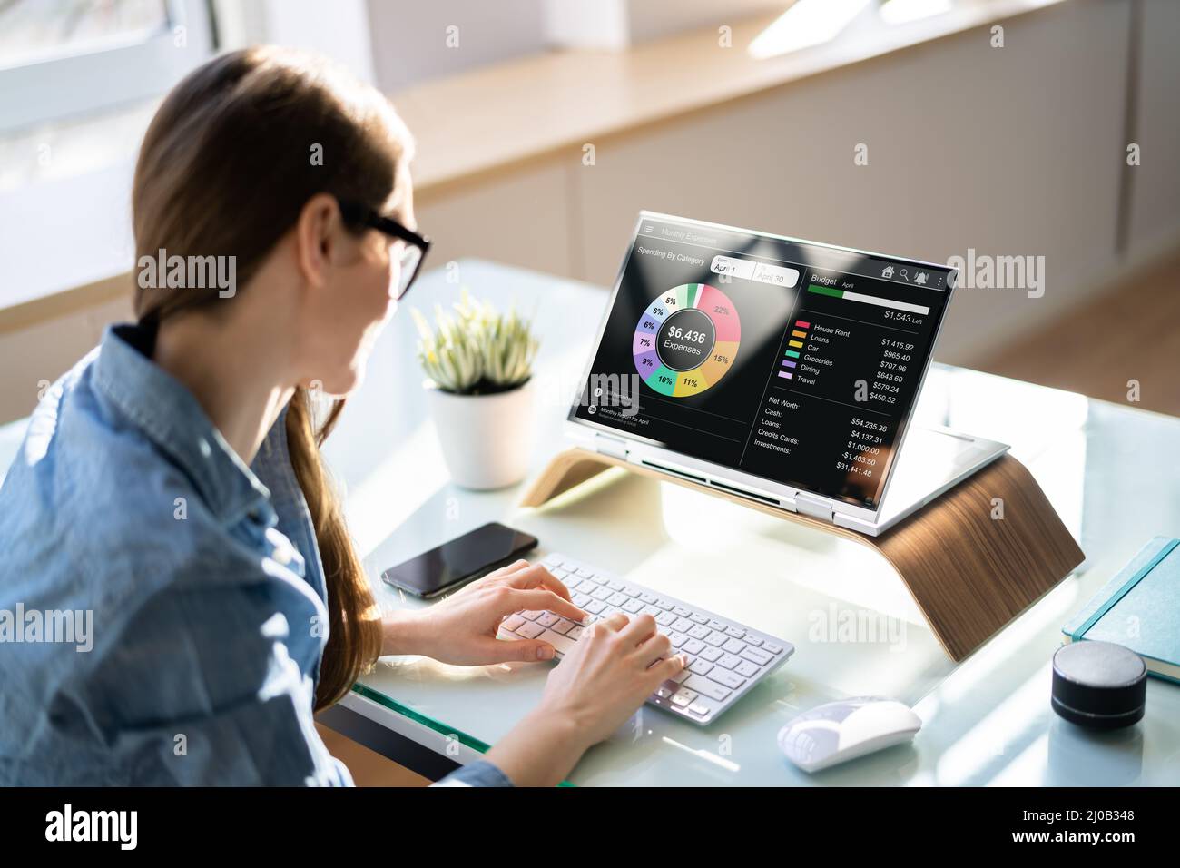 Woman Tracking Budget Using Fintech App On Computer Stock Photo - Alamy