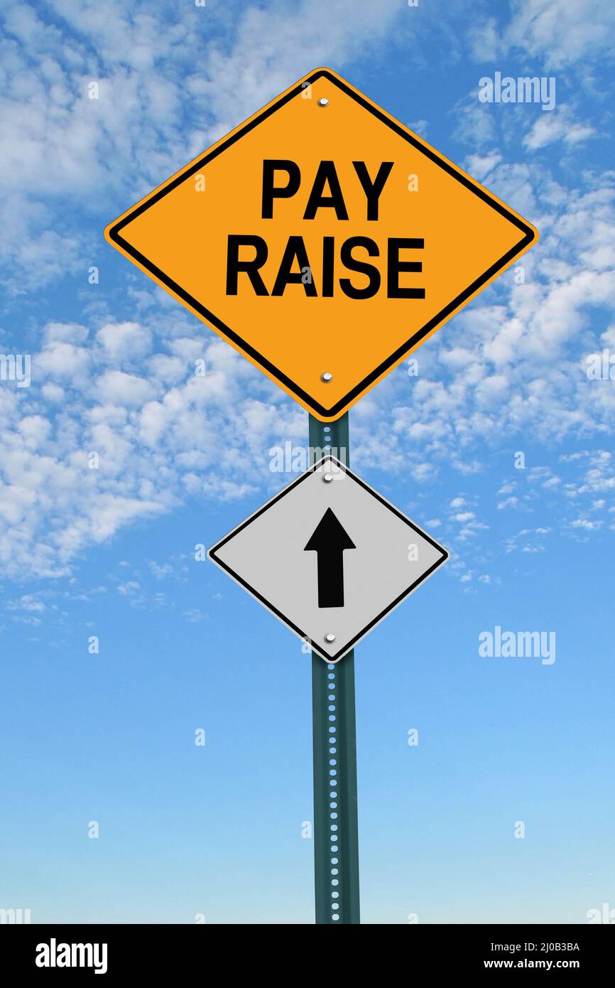 Pay raise ahead roadsign Stock Photo
