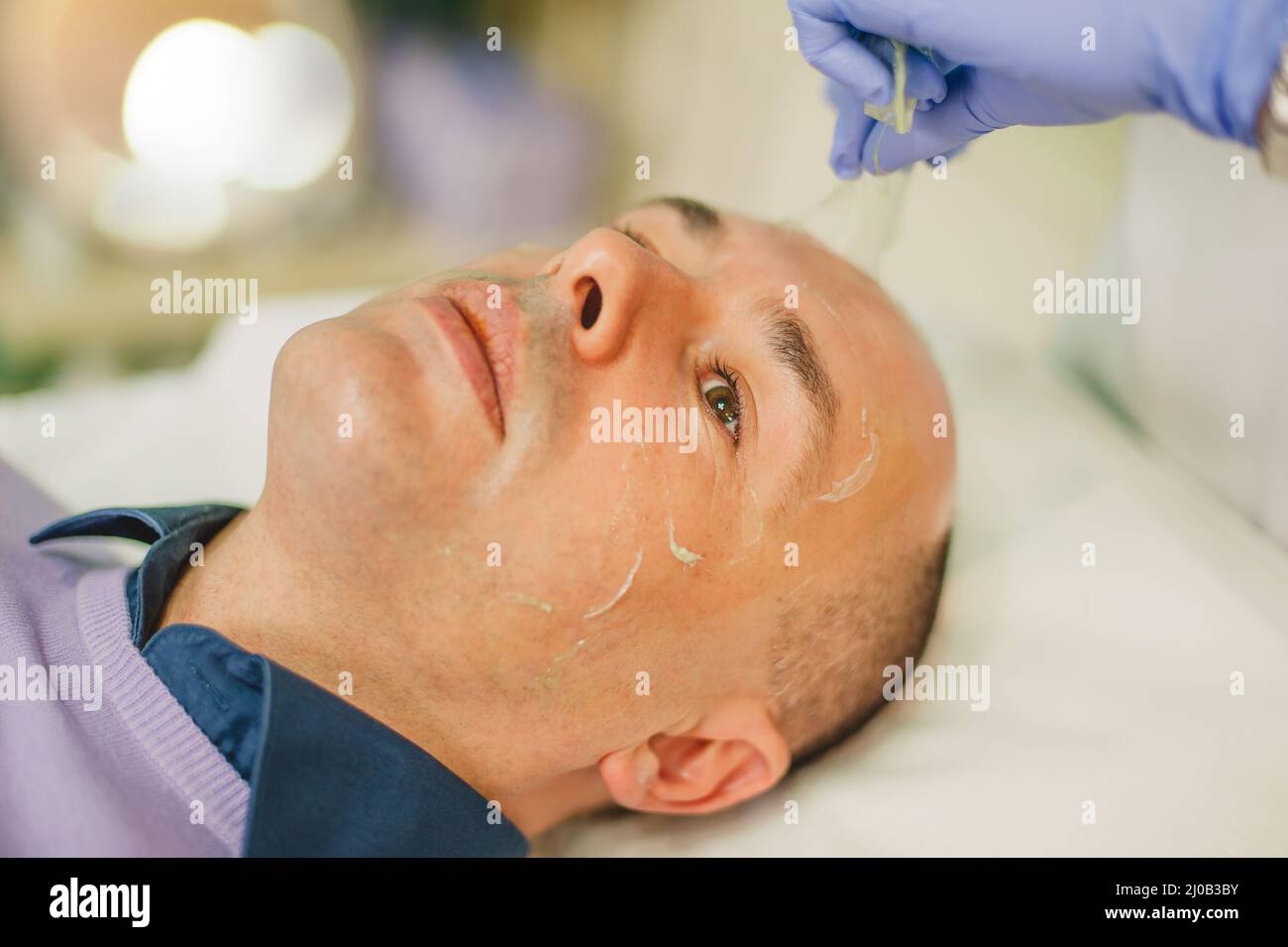 Man peeling off mask hi-res stock photography and images - Alamy