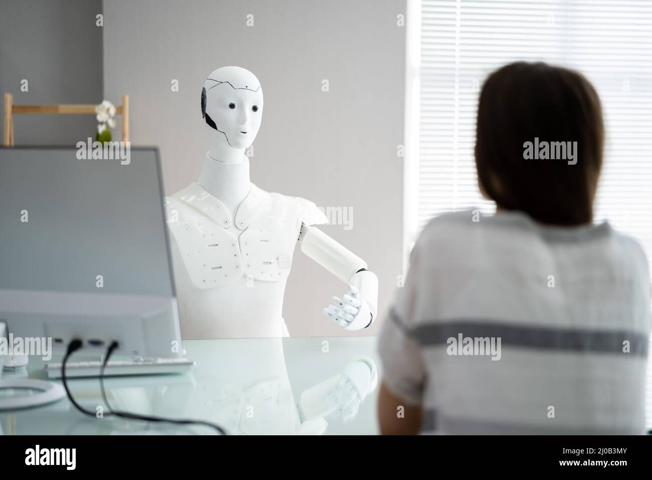 Female Patient Treatment By Robot Doctor In Hospital Stock Photo