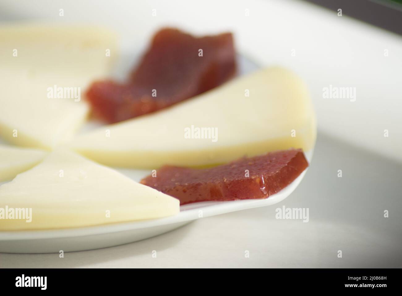 Quince jelly and cheese Stock Photo Alamy