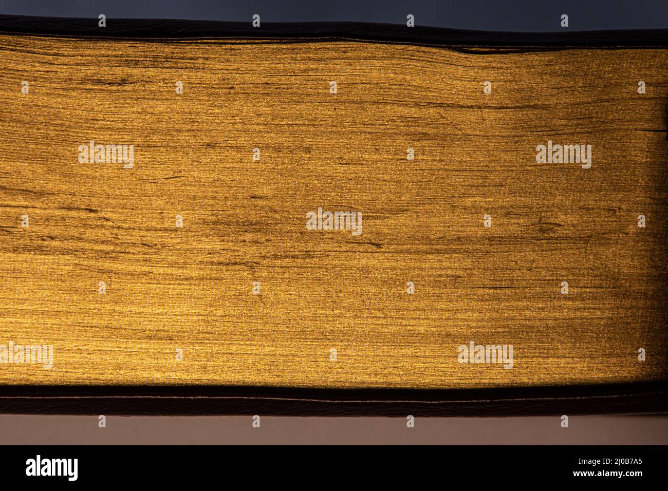 Close up of pages of a book with golden edges, golden texture background Stock Photo Alamy