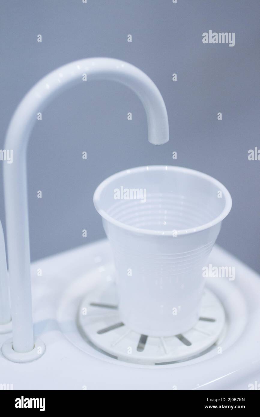 Dentist water cup and tap filler in dental clinic Stock Photo