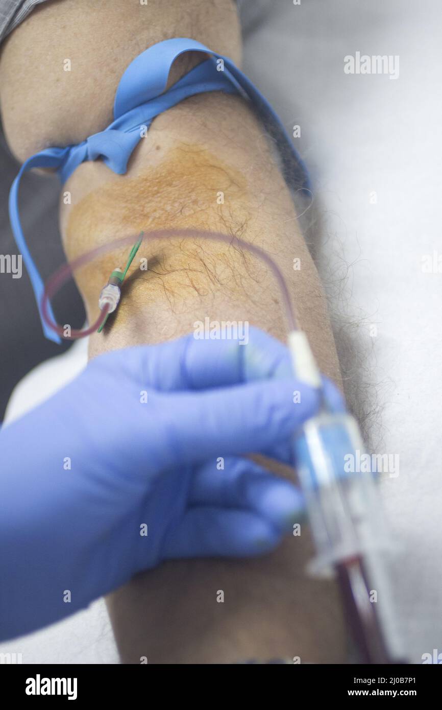 Nurse and male patient blood sample donation Stock Photo Alamy