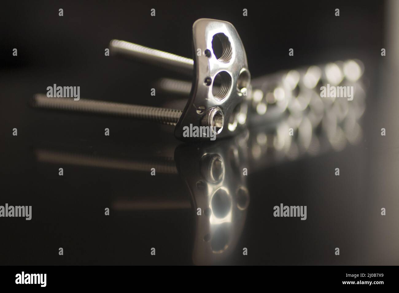Traumatology orthopedic surgery implant plate and screws Stock Photo