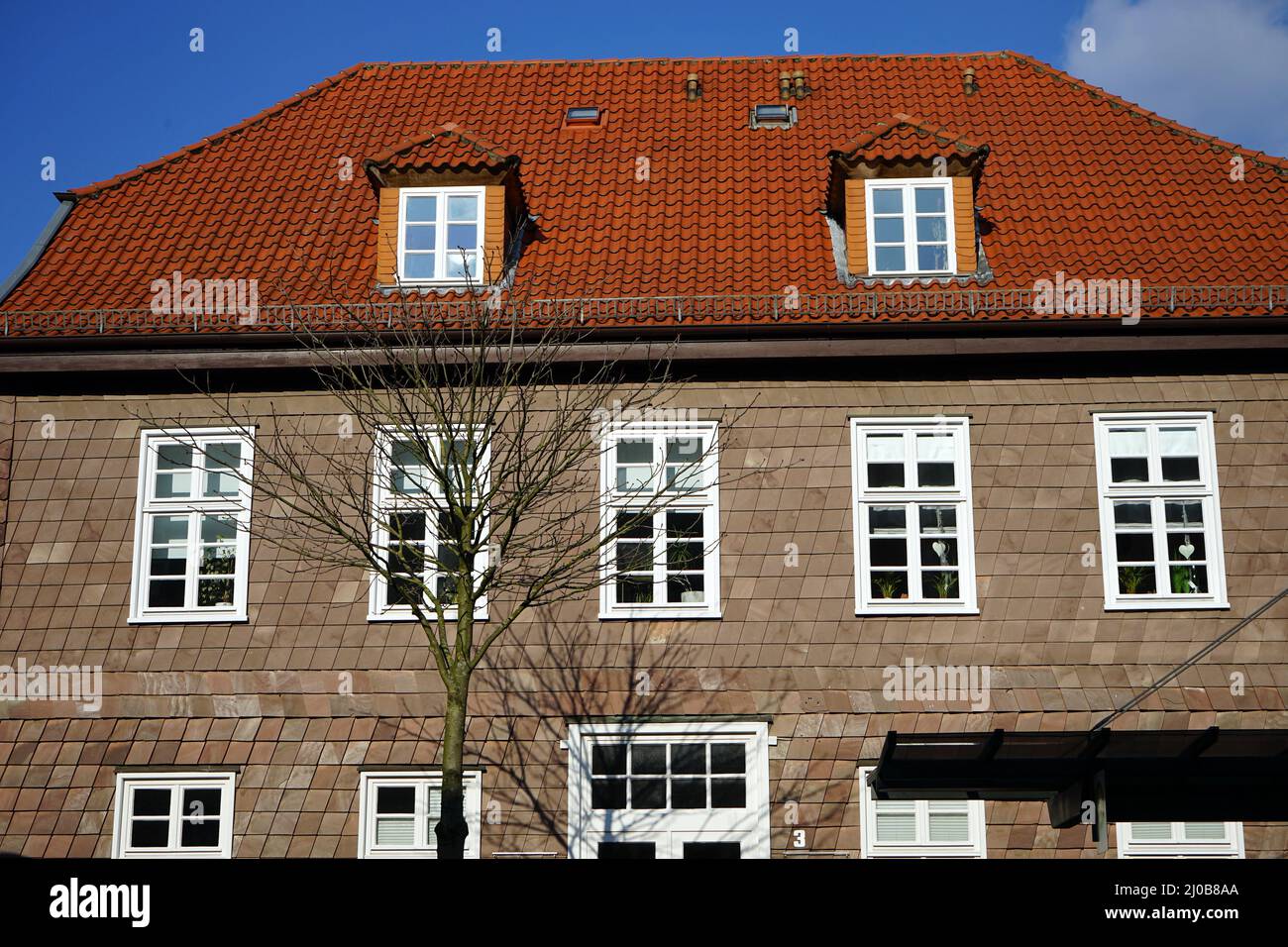 Closeup of a building with a blue sky background Stock Photo - Alamy