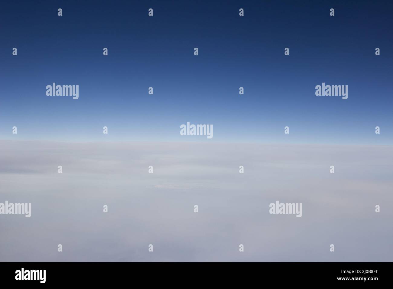 Blue sky with clouds seen from plane window Stock Photo - Alamy