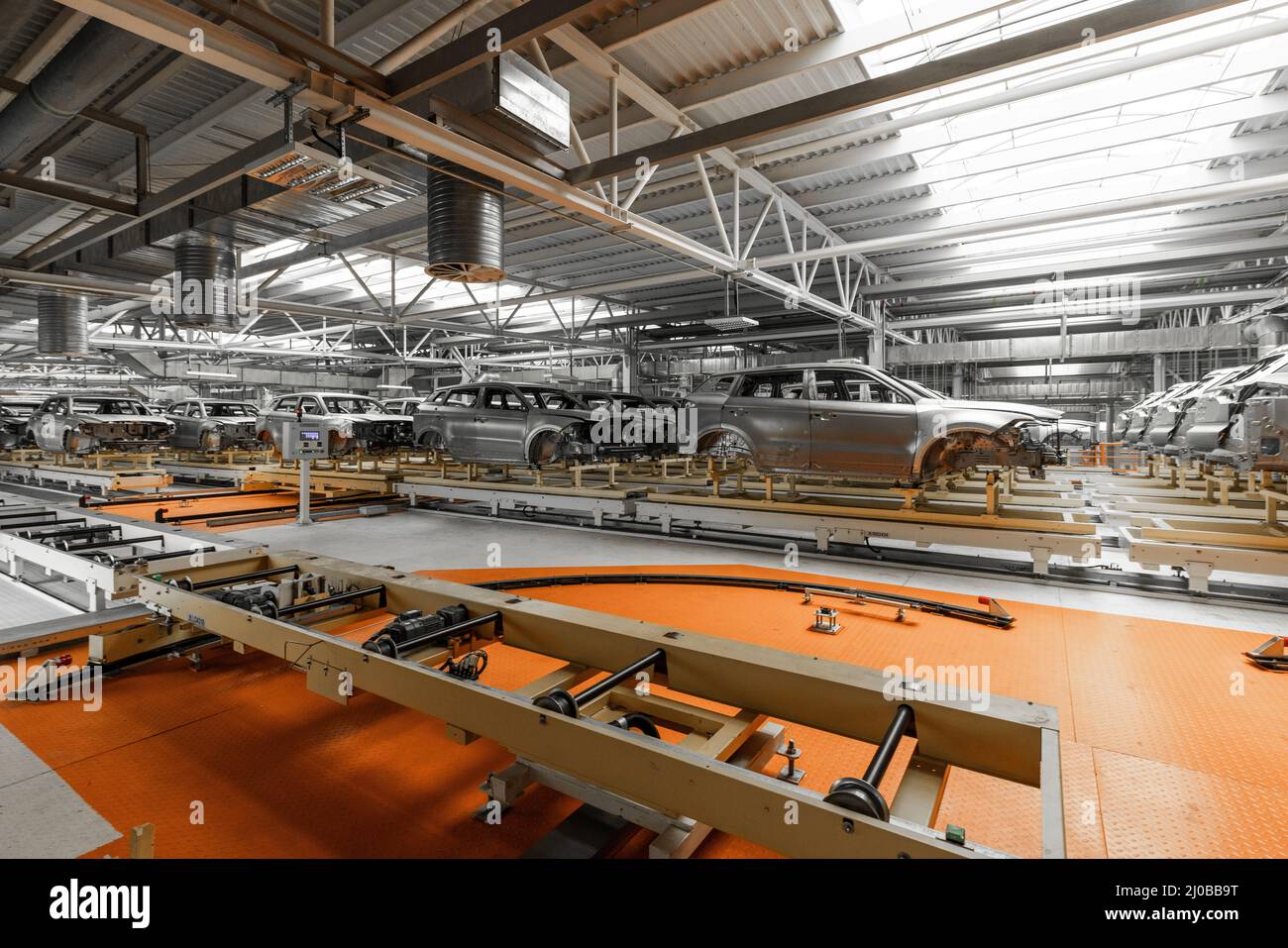 Car bodies are on assembly line. Factory for production of cars. Modern ...