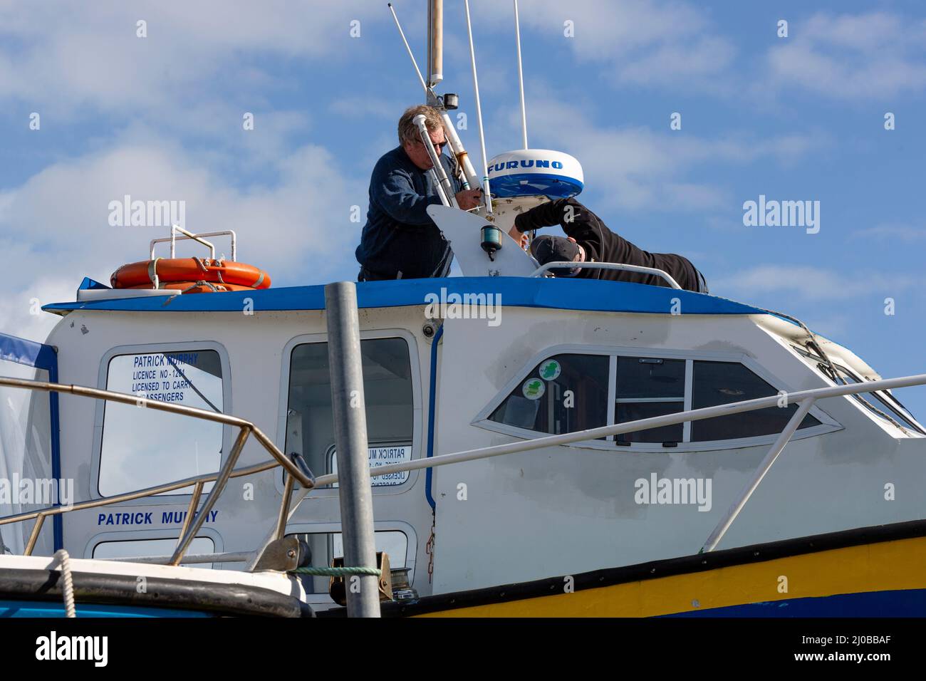 Installing Furuno marine radar on small tourist boat Stock Photo Alamy