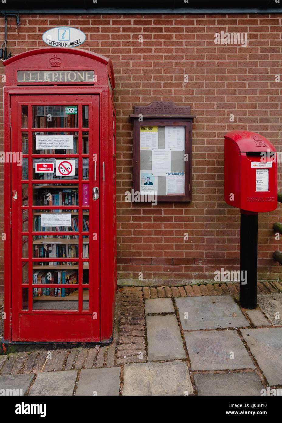 Old red telephone and post box in Flyford Flavell, Worcestershire, England. Stock Photo