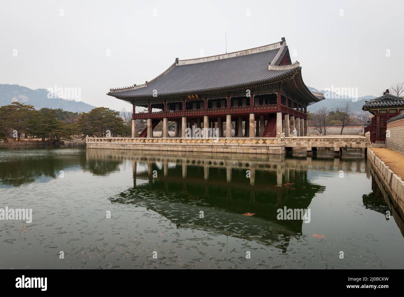Gyeonghoeru pavillon at Gyeongbokgung Palace, Seoul, South Korea against sky Stock Photo