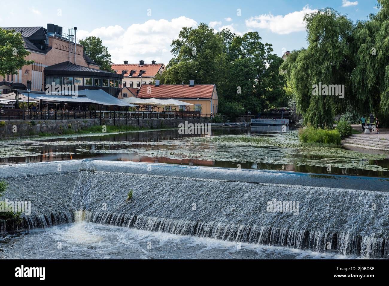 Uppsala, Uppland Sweden - 07 27 2019, Small waterfall in the city river Stock Photo