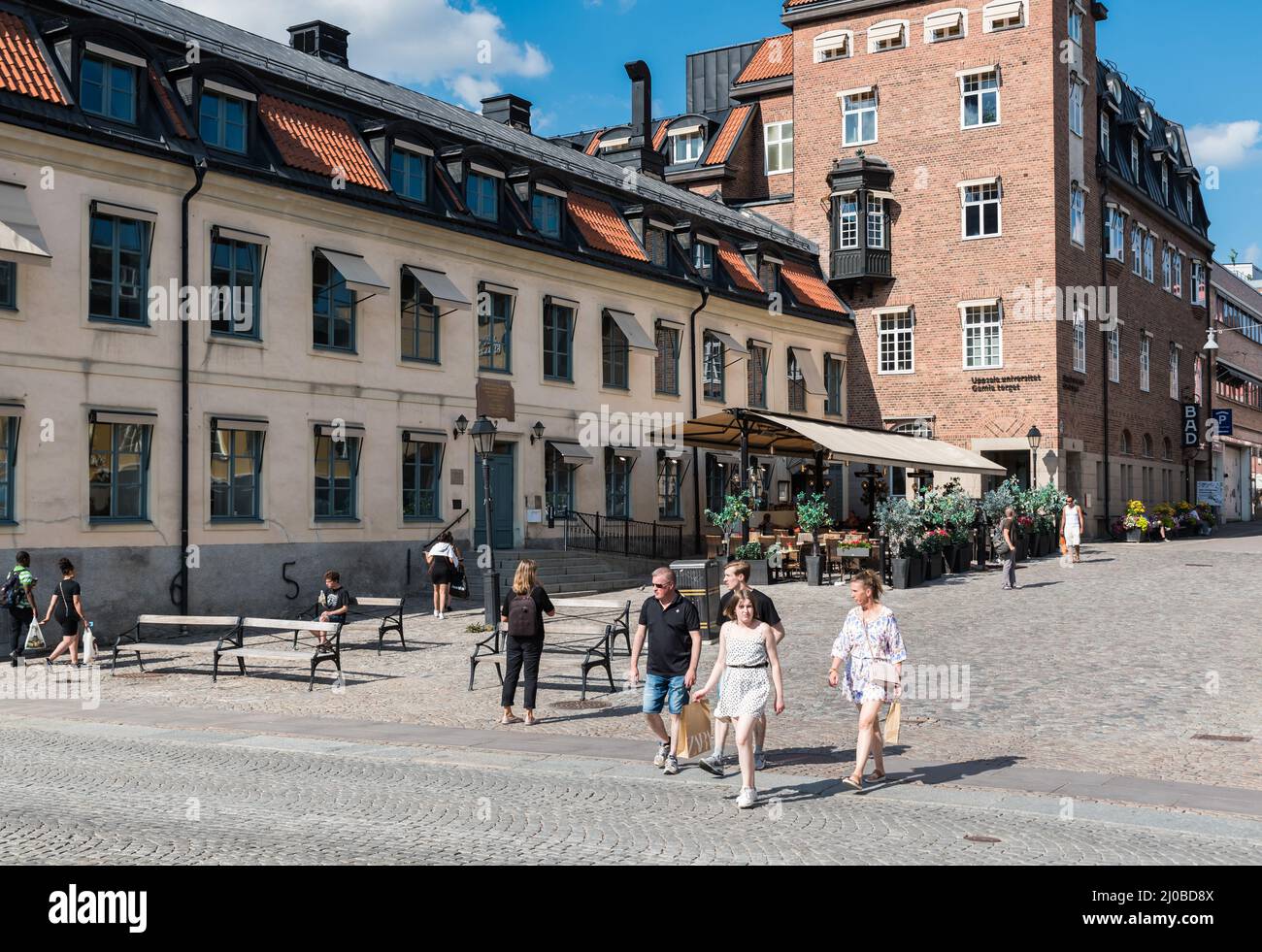 Uppsala, Uppland, Sweden - 07 27 2019- People walking over old town square Stock Photo