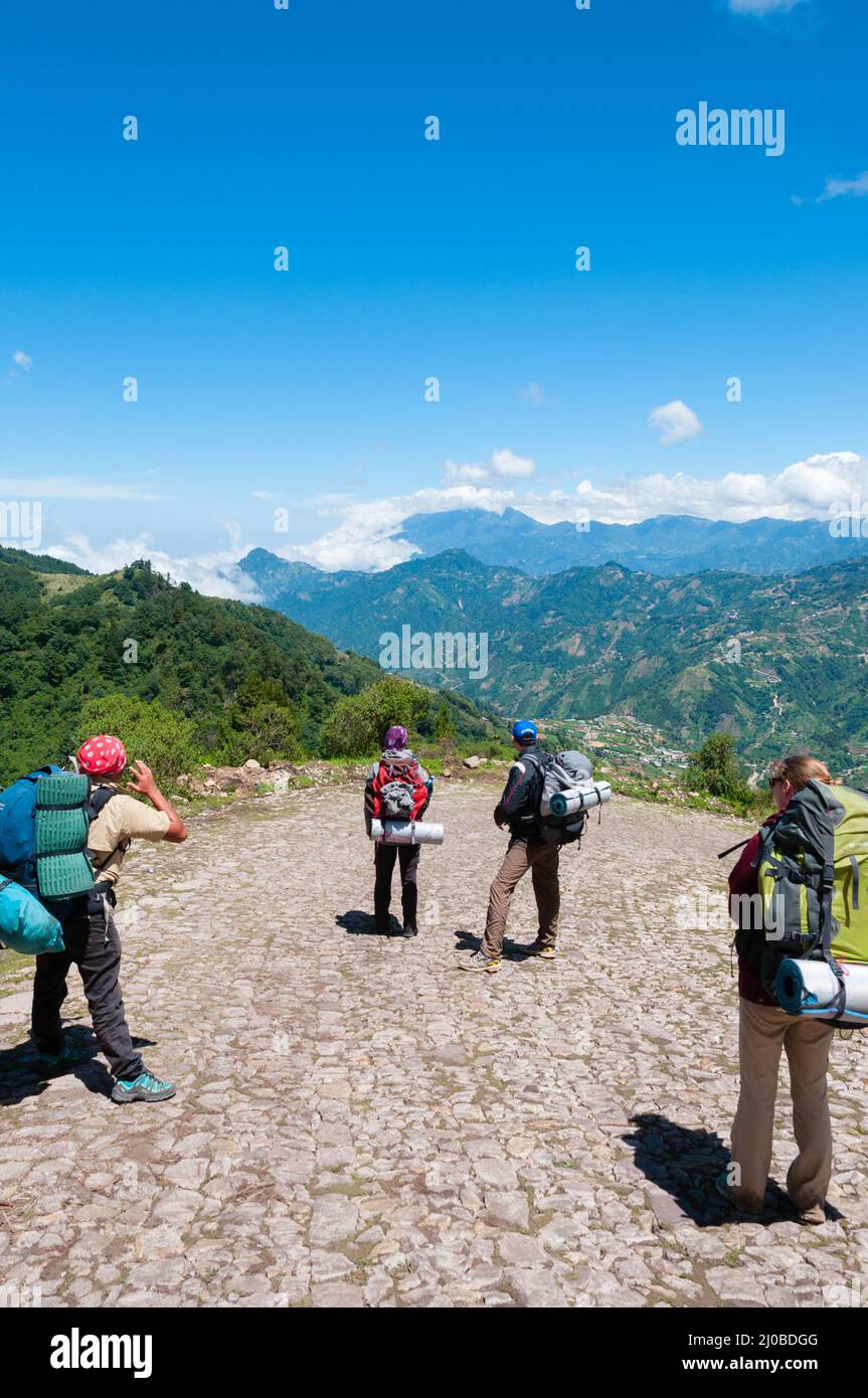 Group of people with backpacks taking a picture and hiking the mountain Tajamulco on pathway Stock Photo