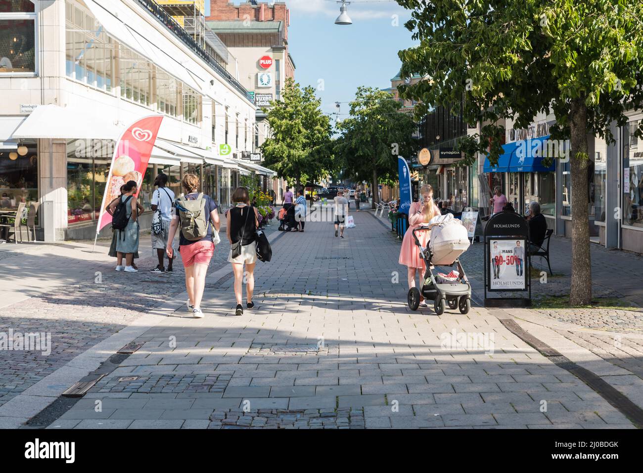 Uppsala, Uppland  Sweden - 07 27 2019- People of mixed ages and gender walking through the shopping streets of the city center Stock Photo