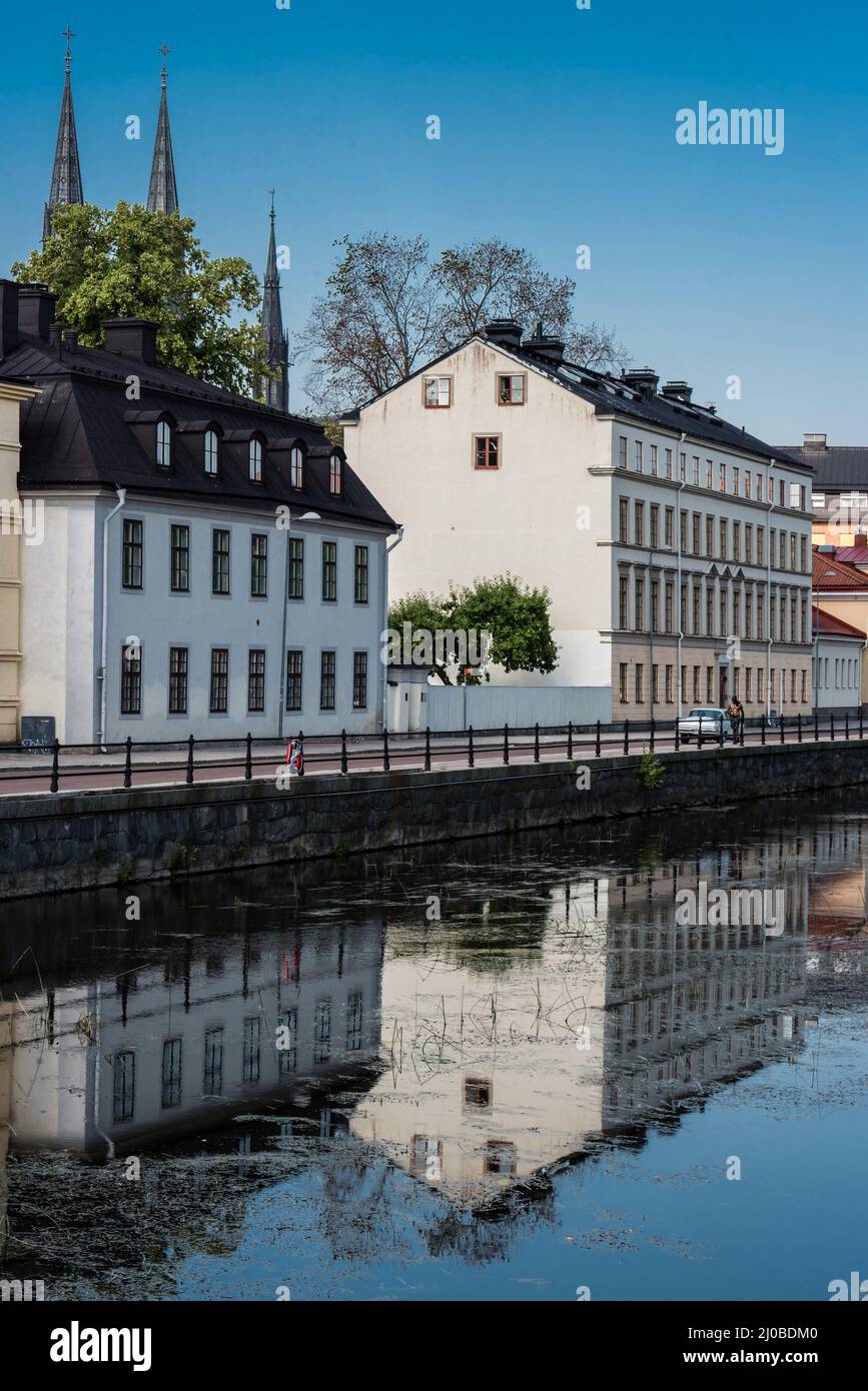 Uppsala, Uppland, Sweden - 07 27 2019- Houses reflecting in the water in old Town Stock Photo