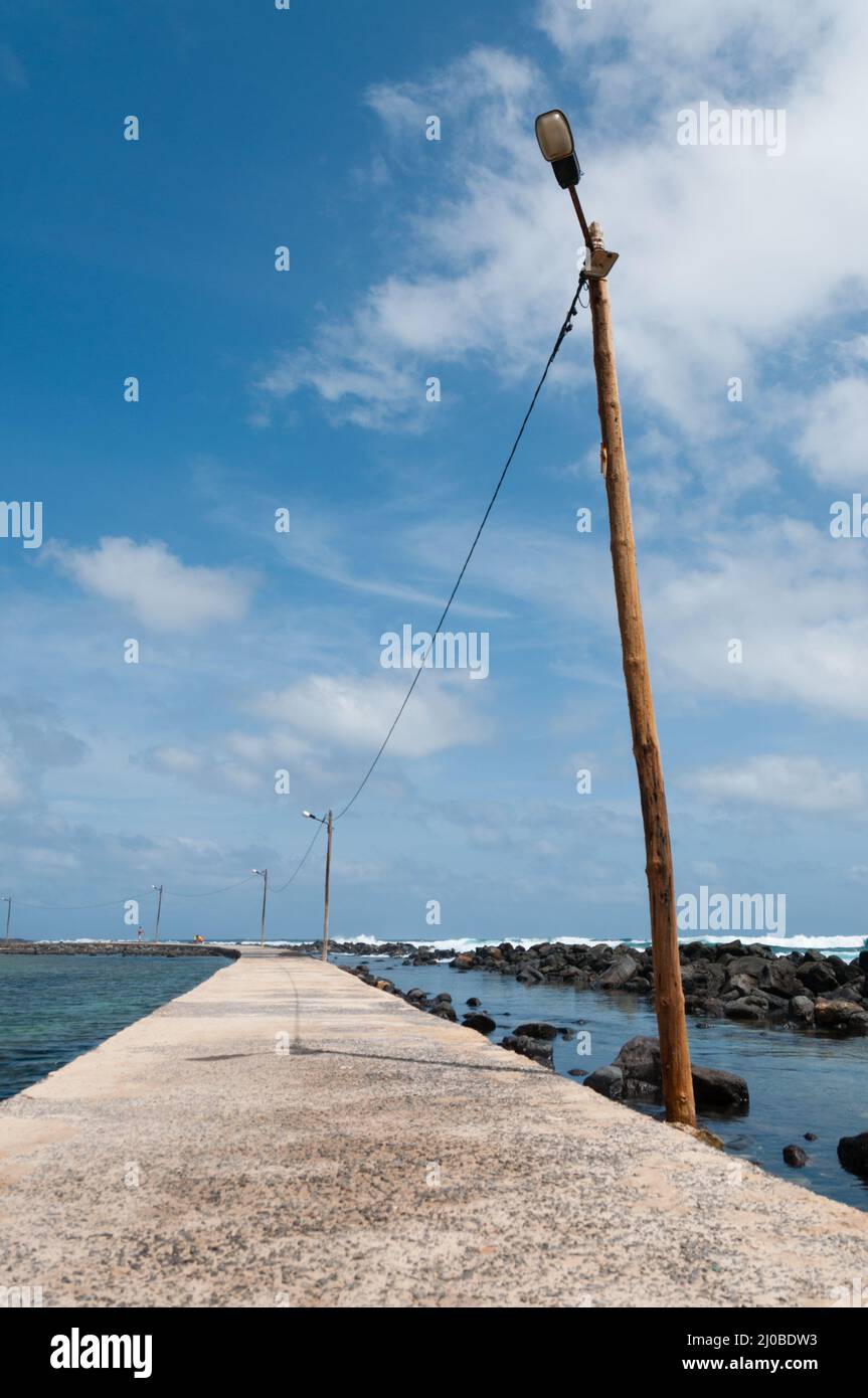 Concrete road next to the sea and sand beach in Cape Verde island Stock Photo