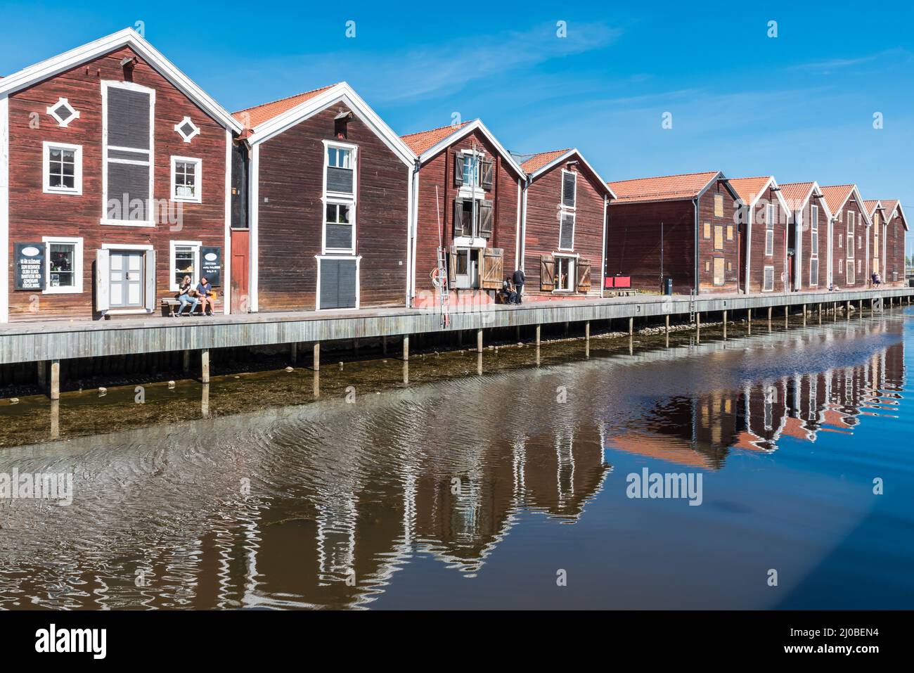 Hudiksvall, Halsingland, Gavleborg County -Sweden - 08 01 2019 Reflecting fishing warehouses in the city center Stock Photo