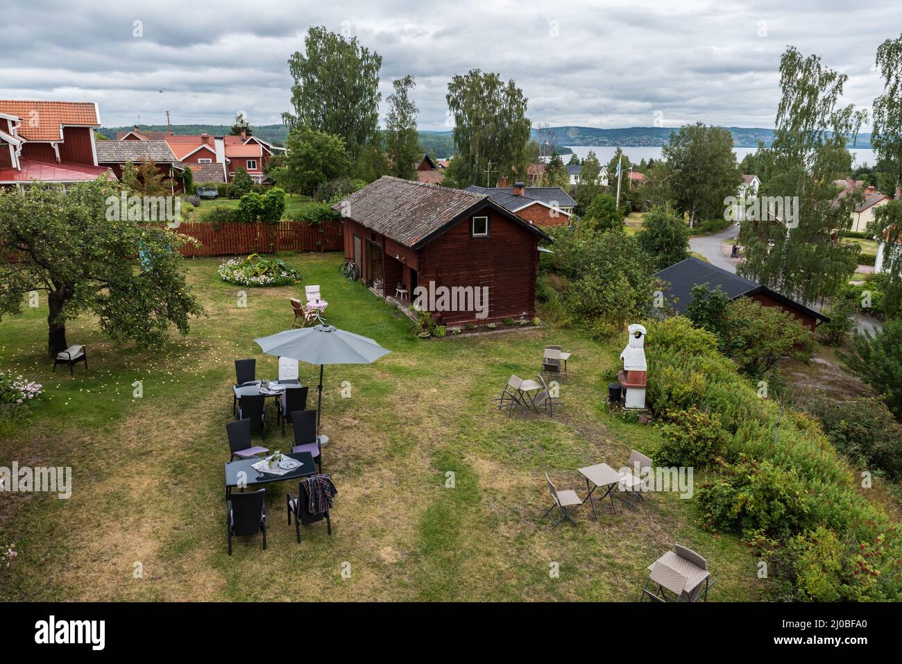 Segersta, Halsingland - Sweden - 08 04 2019: Panoramic view over old village houses with the Ljusnan river in the background Stock Photo