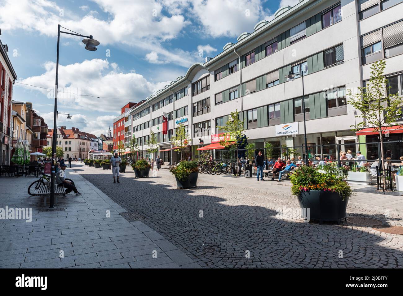 Falun, Dalarna- Sweden - 08 05 2019: People resting and walking in the shoppingstreet Stock Photo