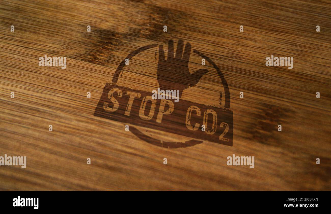 Stop CO2 and carbon neutral stamp printed on wooden box. Eco, environment, zero emission and climate concept. Stock Photo