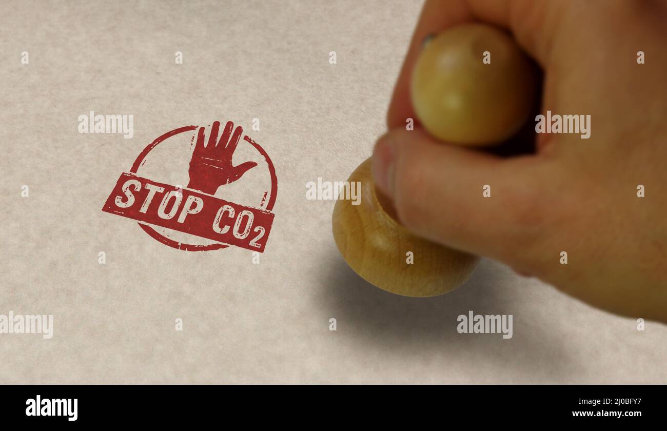 Stop CO2 and carbon neutral stamp and stamping hand. Eco, environment, zero emission and climate concept. Stock Photo