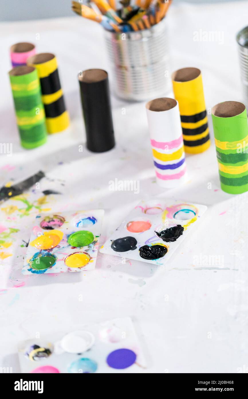 Making different bugs out of empty toilet paper rolls during ...